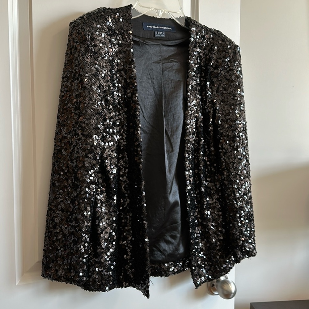 Black sequins blazer. Worn once! In perfect condition.